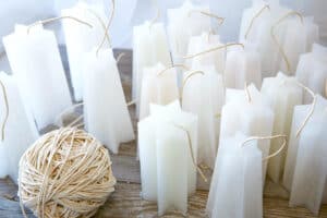 The Best Gifts For Candle Makers - The Creative Folk Rows of white star-shaped candles with a ball of wick twine