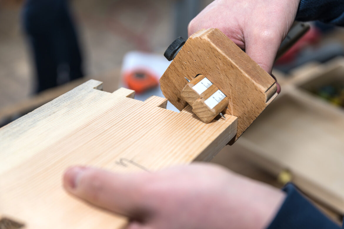 Carpenter Using Marking Gauge
